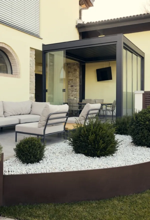 Covered outdoor lounge area with sofas.